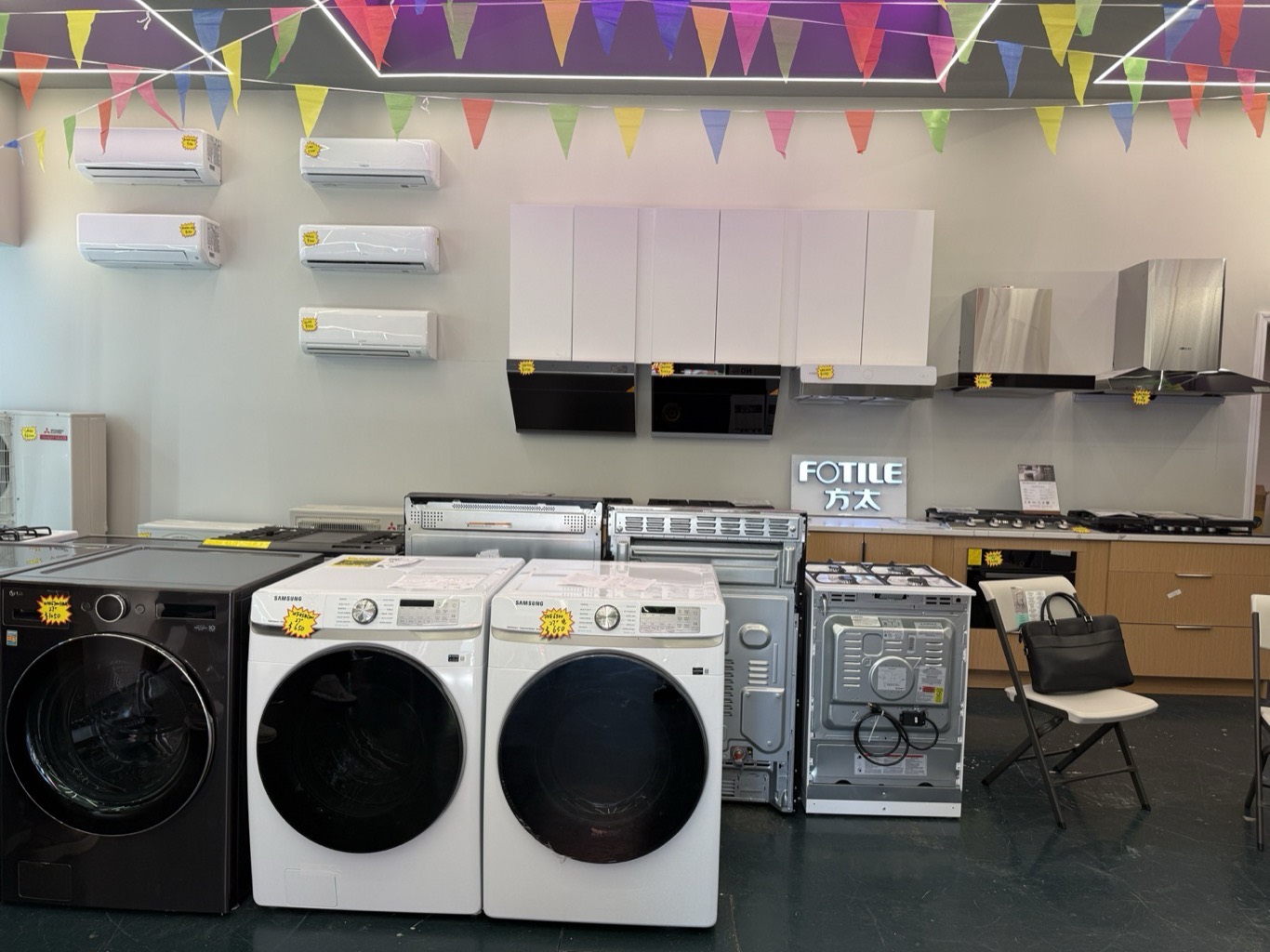 Inside the New Elite AC Supply showroom: wall-mounted ductless mini-split air conditioners, washers, dryers and range hoods
